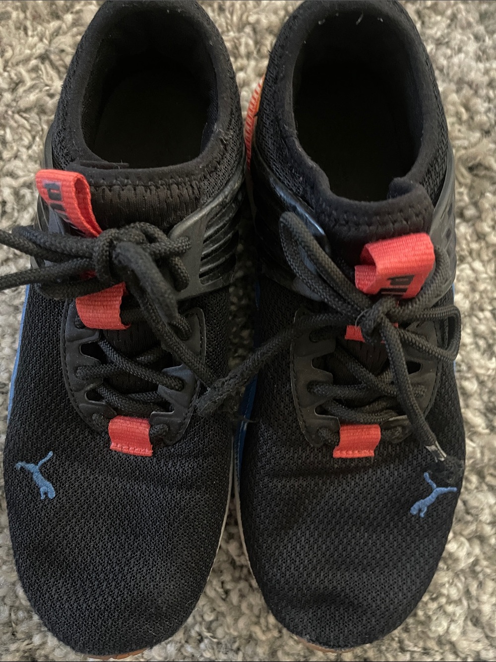 Puma Black Sneakers with Red Tabs and Blue Logos
